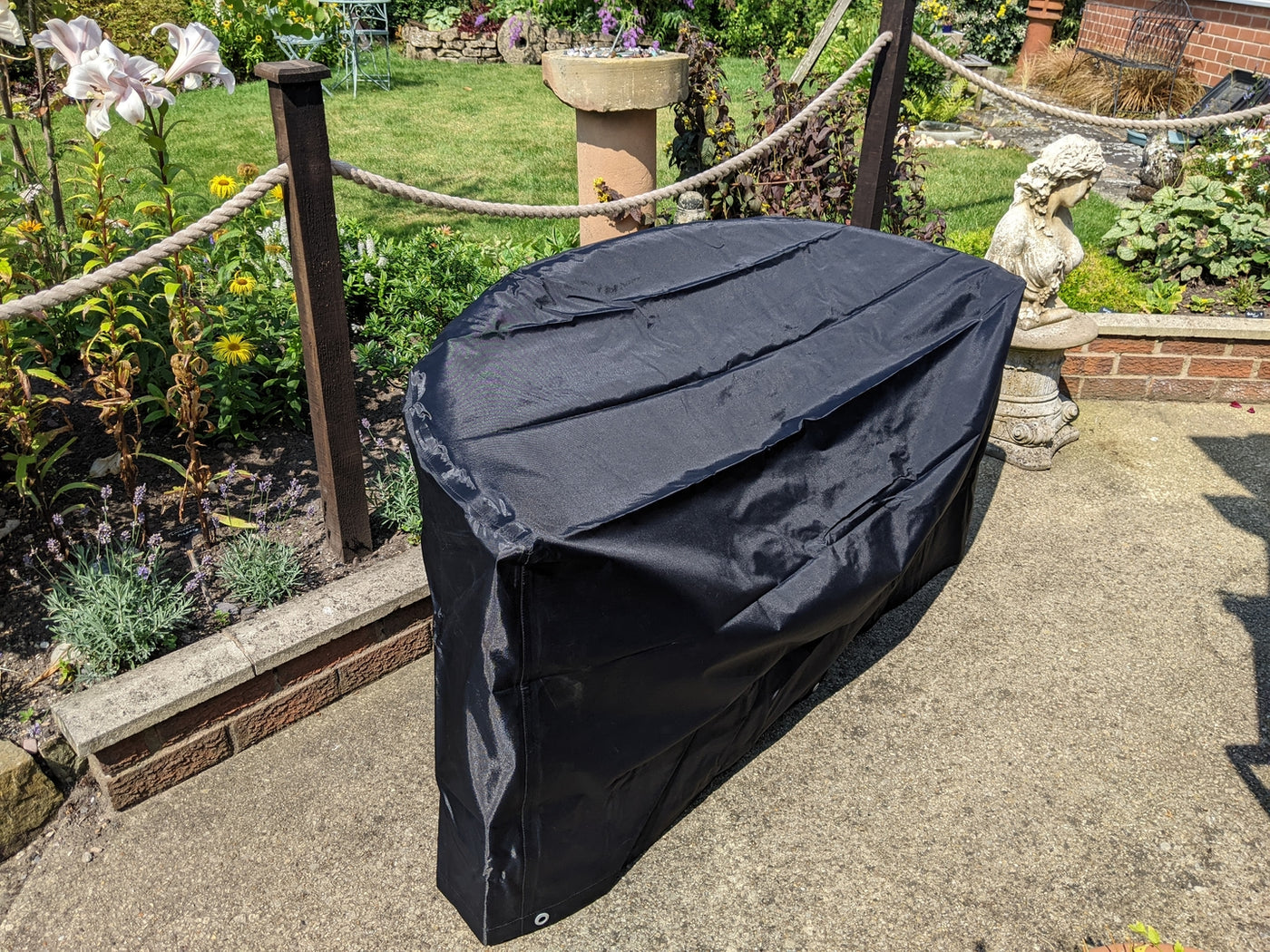 Phil's custom garden bench cover fitted to his curved teak banana bench